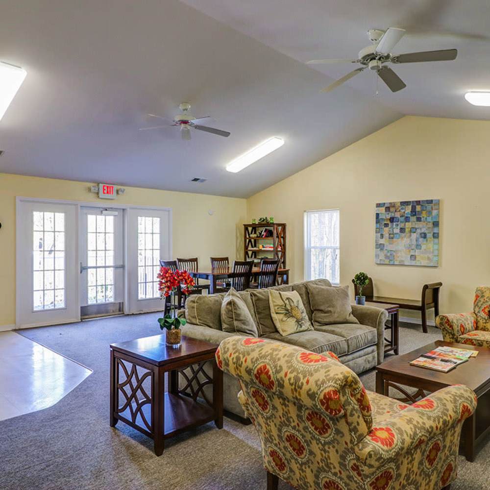 Cozy clubhouse with seating areas and natural light at Pinecrest Greene in Charleston, South Carolina