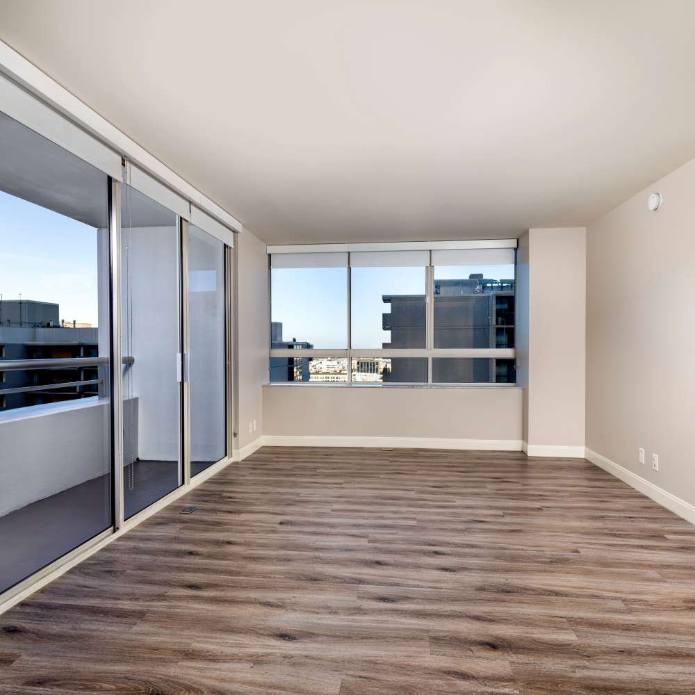 Empty living room, big windows, city, Museum Tower in Los Angeles, California