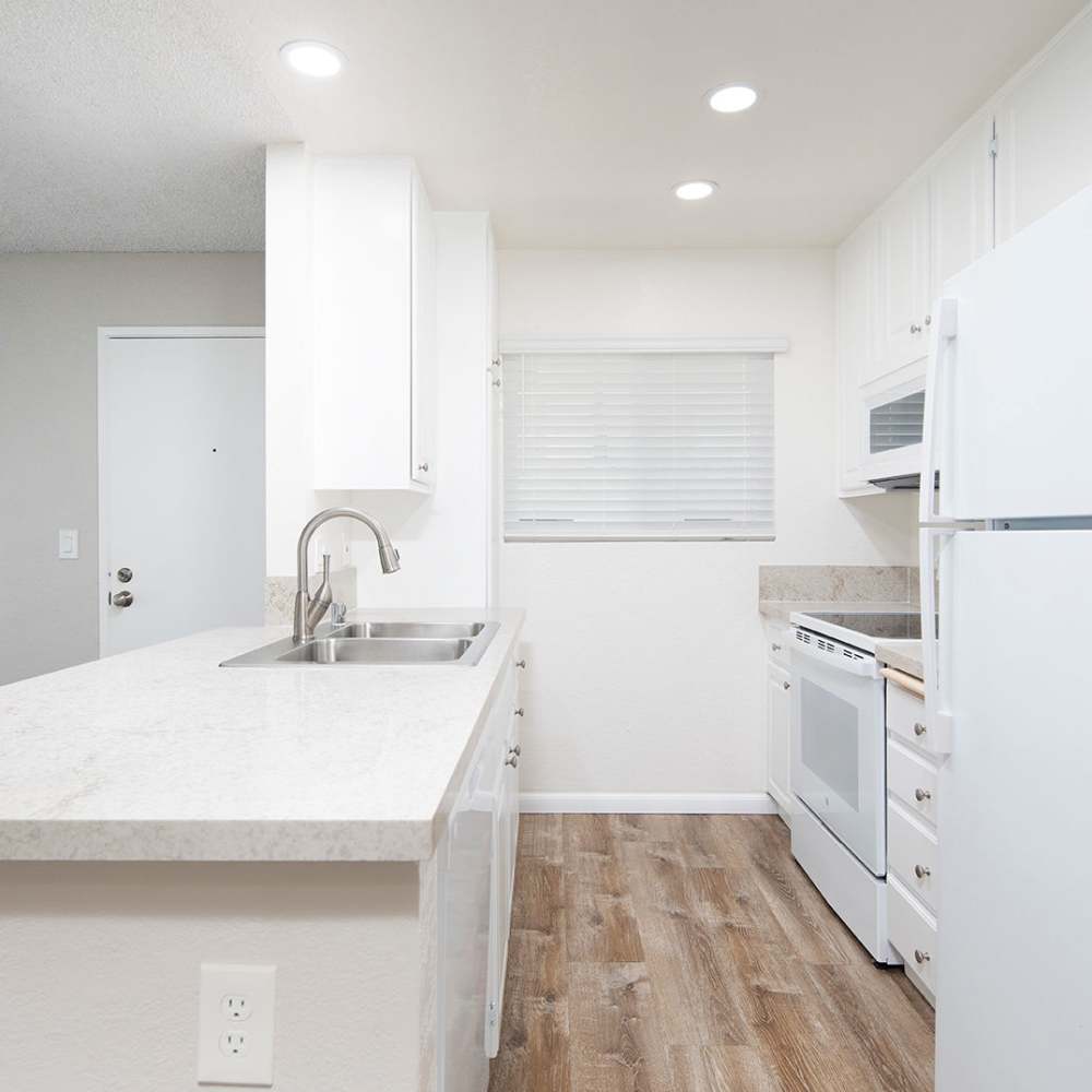 Spacious kitchen with granite countertops at Wexford Manor Apartments in San Diego, California