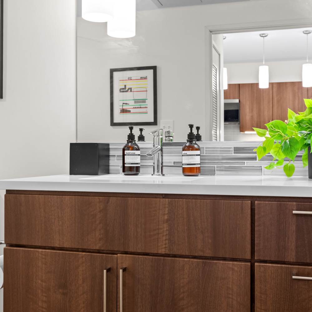 Hardwood-style flooring in the well-furnished living area of an apartment home at Centric in Cleveland, Ohio