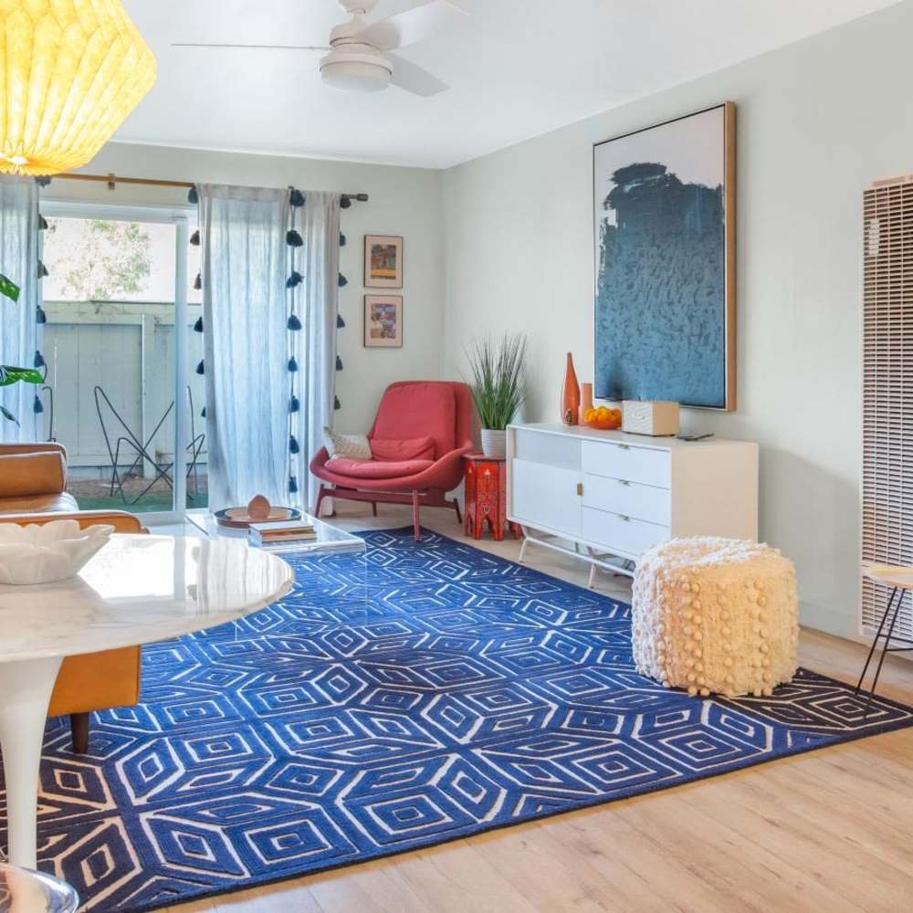 Living room with modern decor and sliding door at Tempo Fremont in Fremont, California