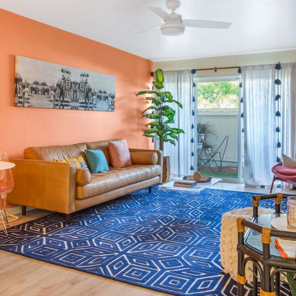 Cozy living room with patterned rug at Tempo Fremont in Fremont, California