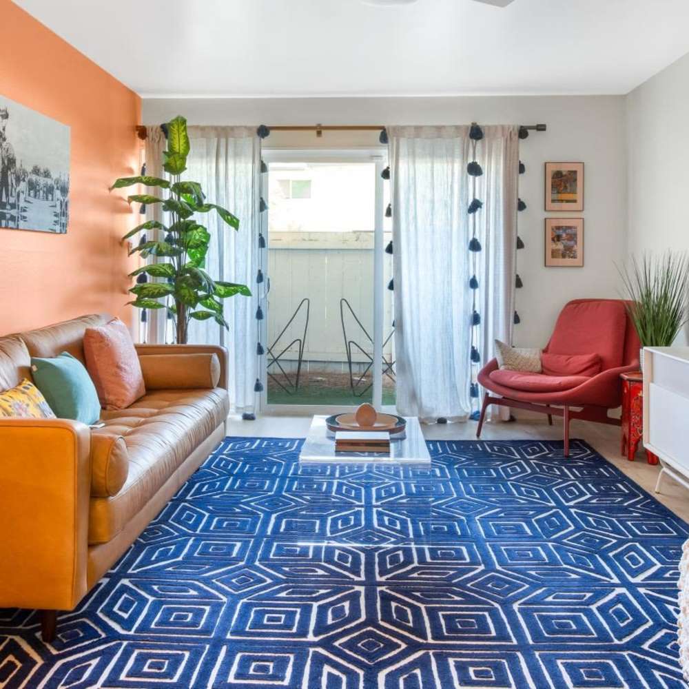 Cozy living room with patio access at Tempo Fremont in Fremont, California