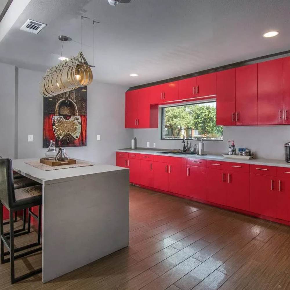 Red cabinets in the kitchen at Barcelo Apartment Homes in San Antonio, Texas