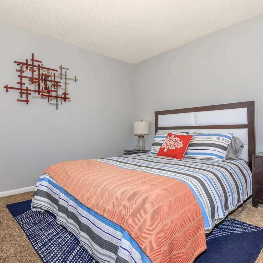 Queen size bed in the bedroom at Barcelo Apartment Homes in San Antonio, Texas