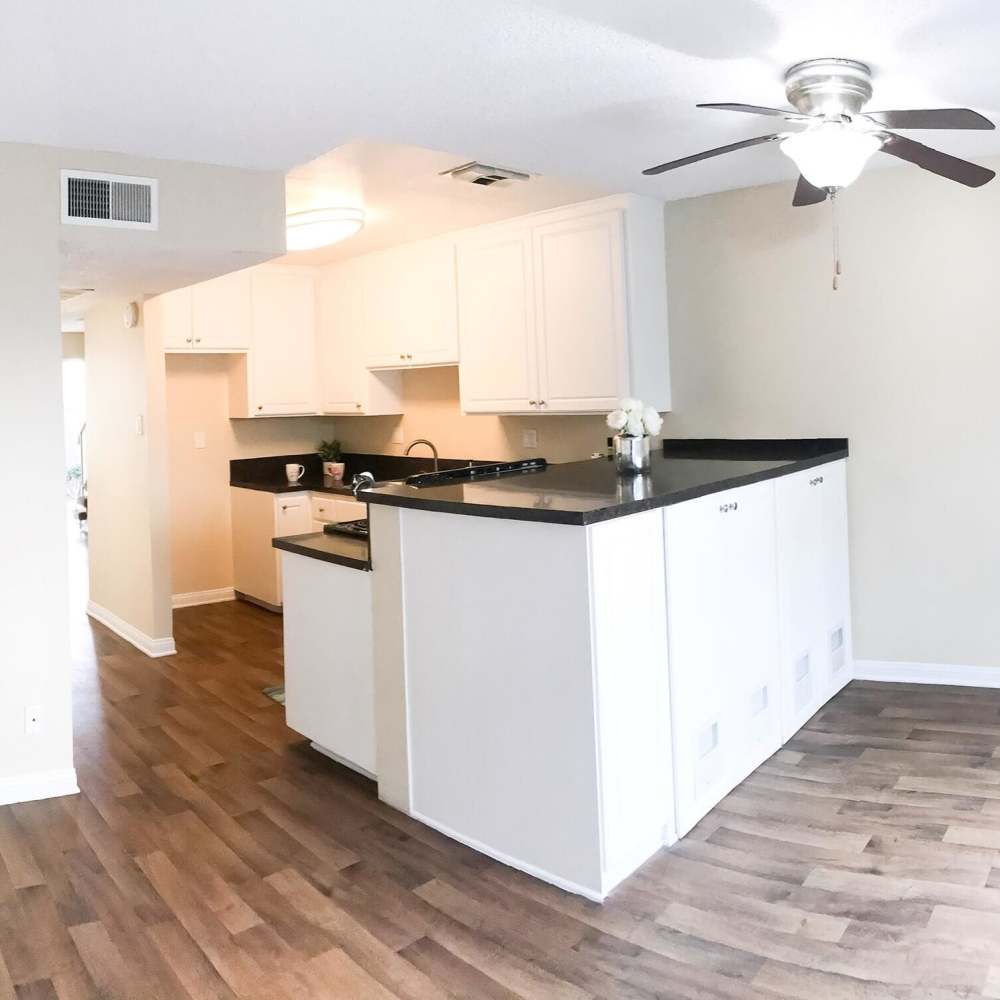 Kitchen with granite countertops at Terramonte Apartment Homes in Pomona, California