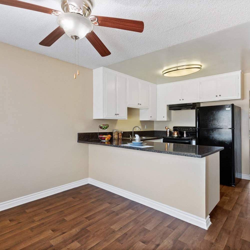 Granite countertops with stainless steel appliances at Terramonte Apartment Homes in Pomona, California
