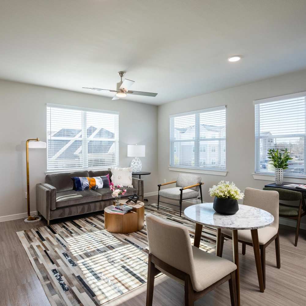 Living room with modern furnishings at August Friendswood in Friendswood, Texas