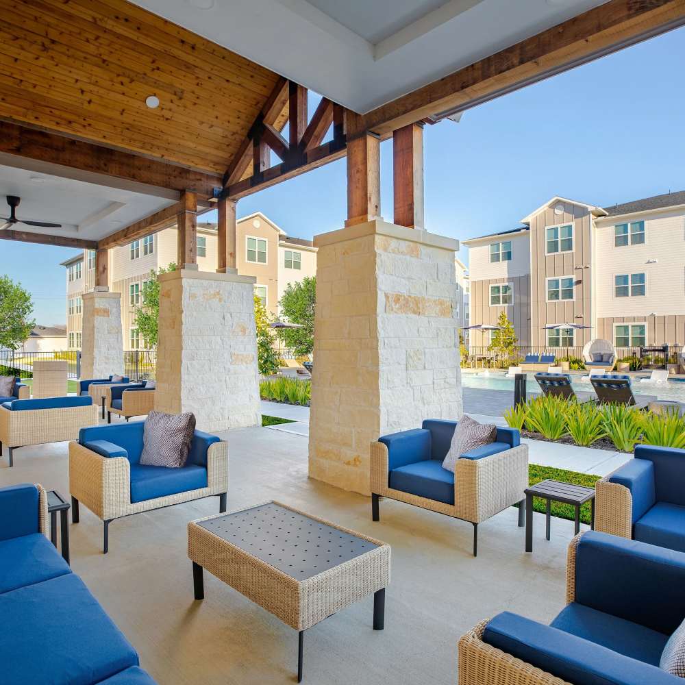 Lounge area with seating and outdoor views at August Friendswood in Friendswood, Texas