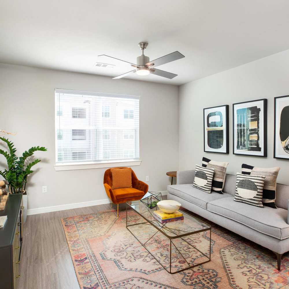 Stylish living room with modern decor at August Friendswood in Friendswood, Texas