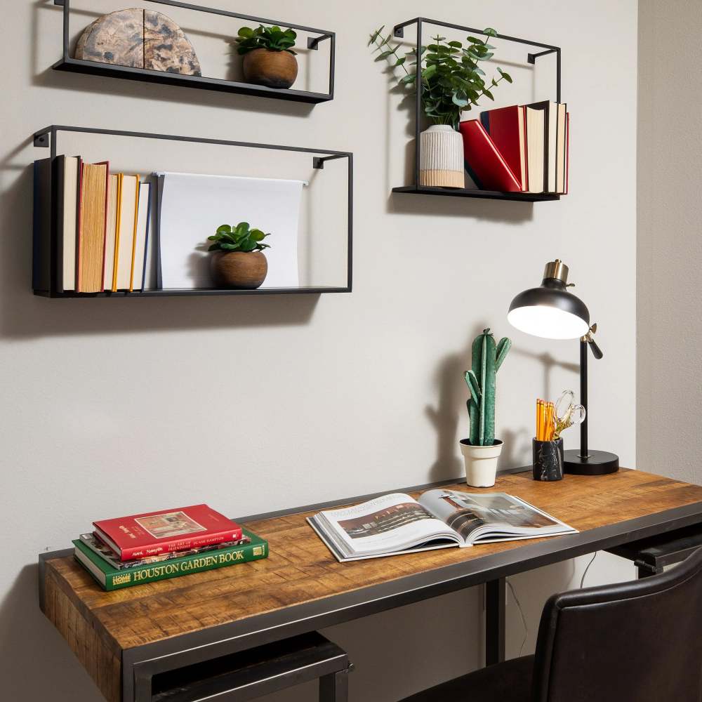 Stylish workspace with books and plants at August Friendswood in Friendswood, Texas