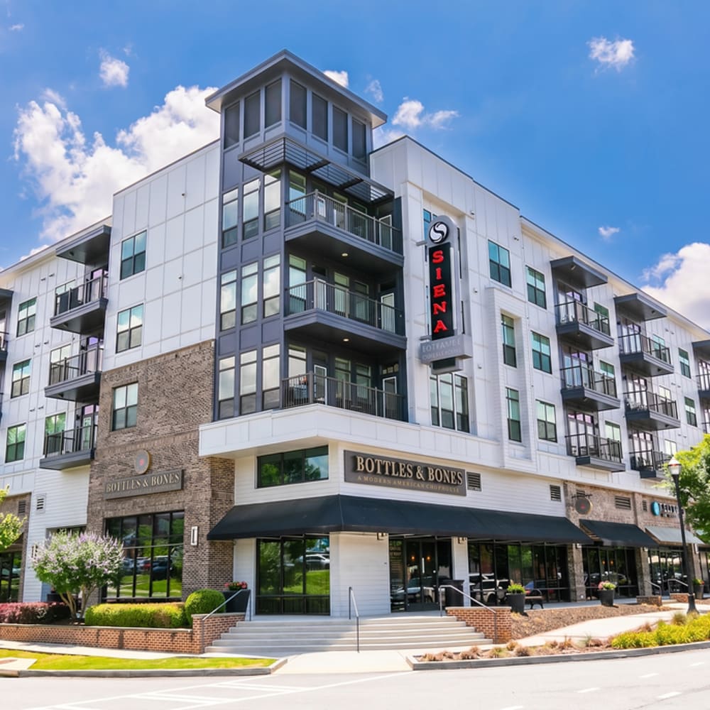 External view of garden-style apartment at Siena Suwanee Town Center in Suwanee, Georgia
