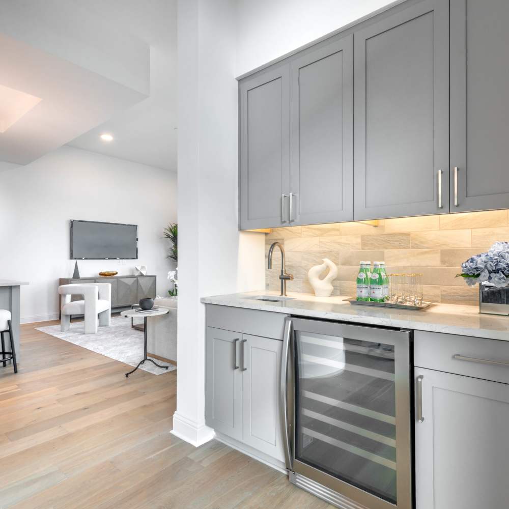 Modern kitchen with gray cabinets at Novel Turtle Creek in Dallas, Texas