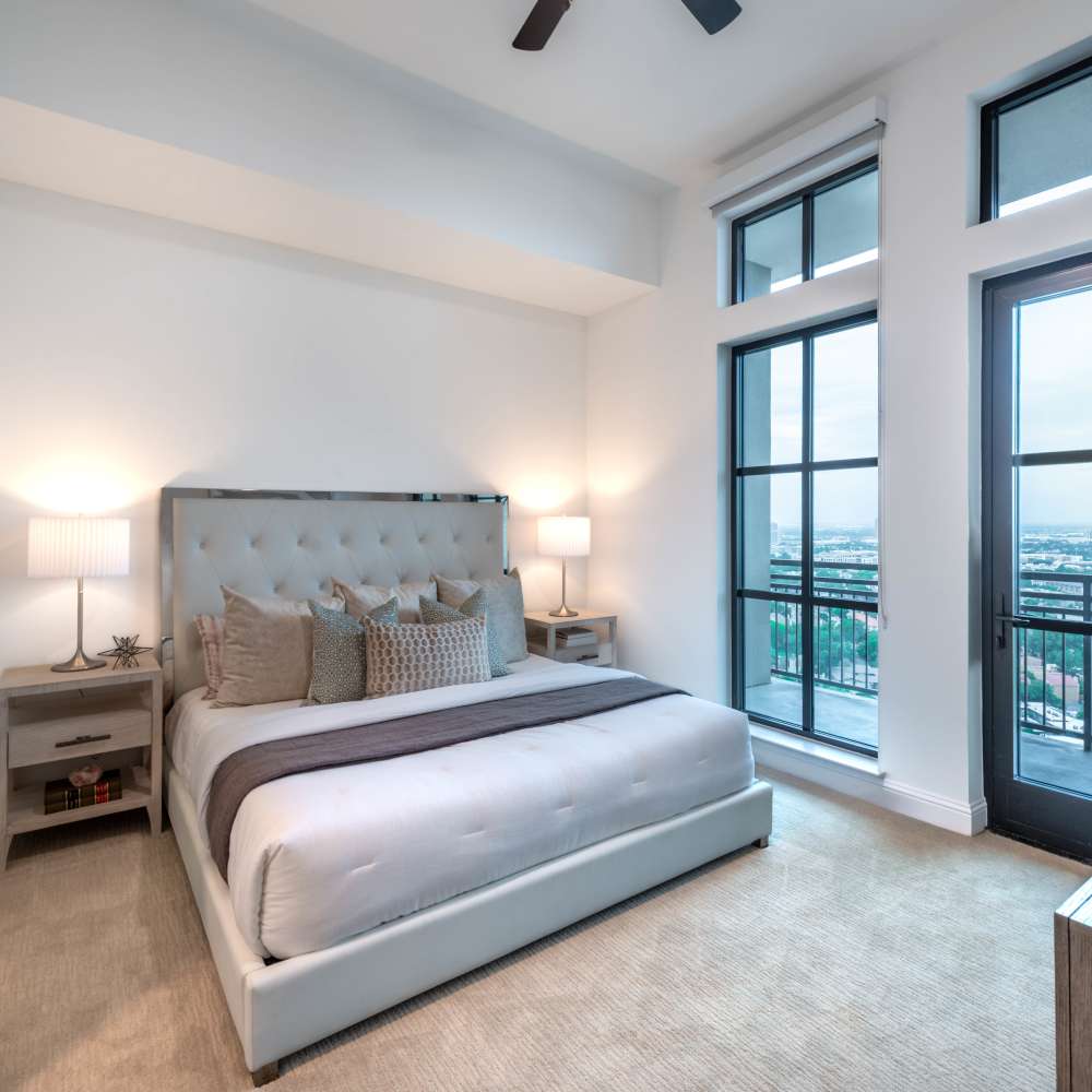 Spacious bedroom with large windows at Novel Turtle Creek in Dallas, Texas