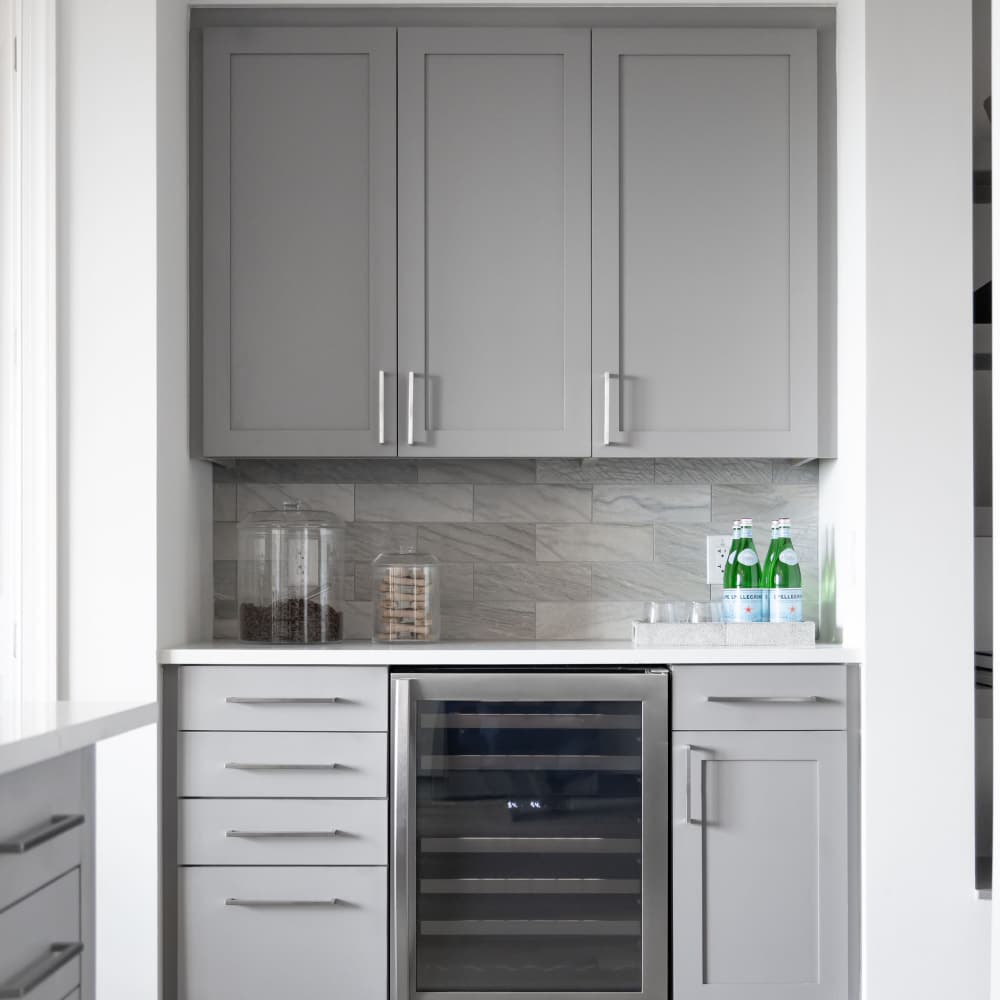 Modern kitchen with decorative glass jars on countertop at Novel Turtle Creek in Dallas, Texas