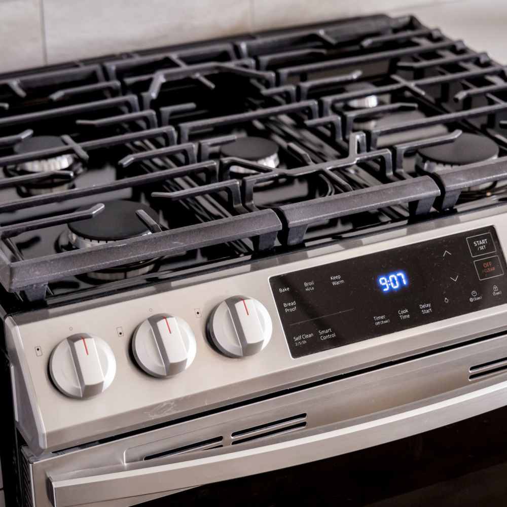 Stainless steel gas range with digital display at Novel Turtle Creek in Dallas, Texas