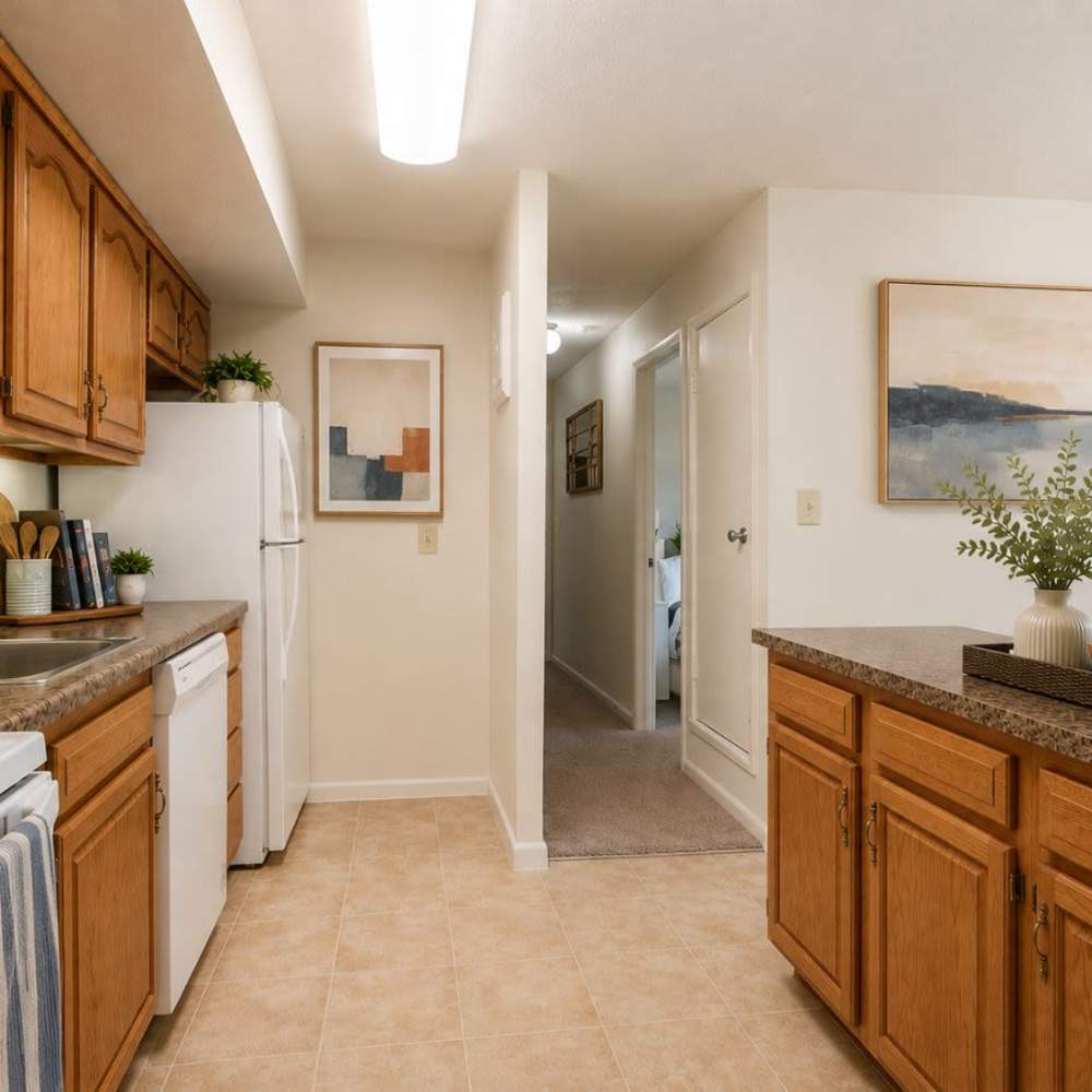 Kitchen with white appliances at Morningside Apartments & Townhomes in Owings Mills, Maryland