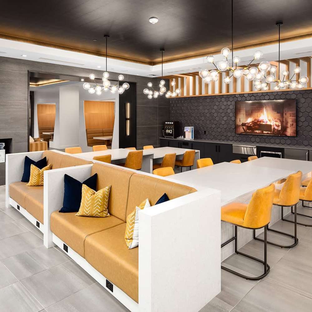 Seating area with cushions and tables at Novel Midtown in Atlanta, Georgia