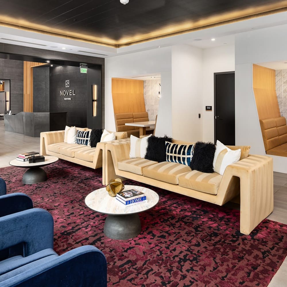 Beige sofas with black and white pillows at Novel Midtown in Atlanta, Georgia