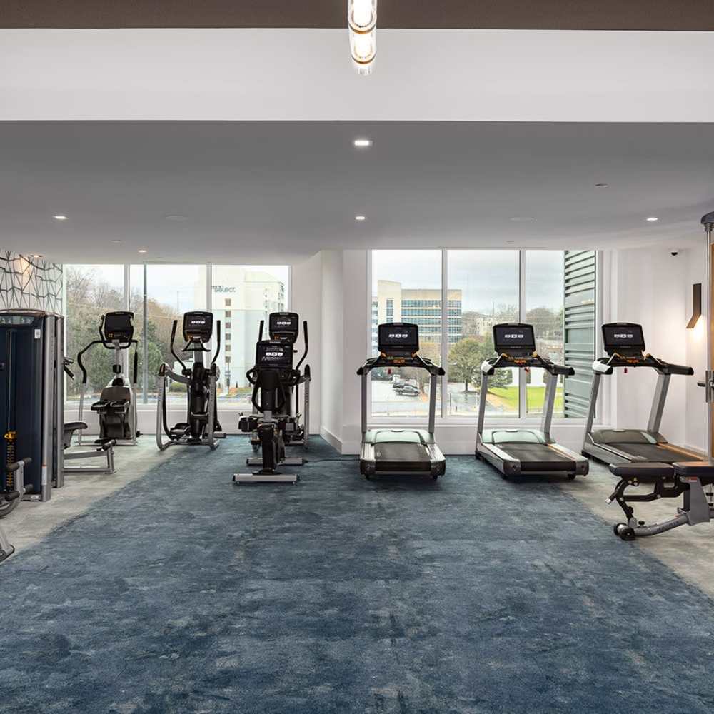 Fitness equipment in a bright room at Novel Midtown in Atlanta, Georgia