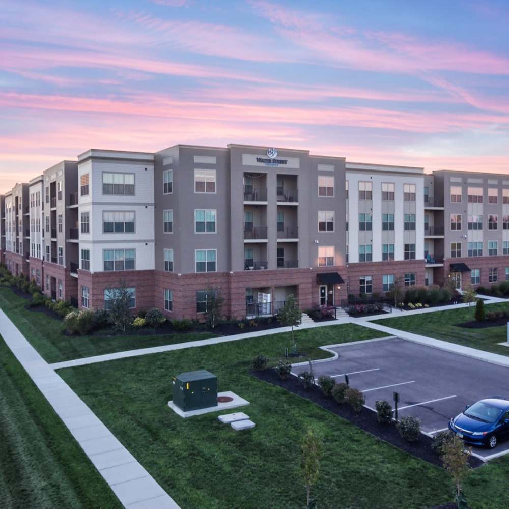 Parking and well-manicured grounds at Water Street Apartments in Dayton, Ohio