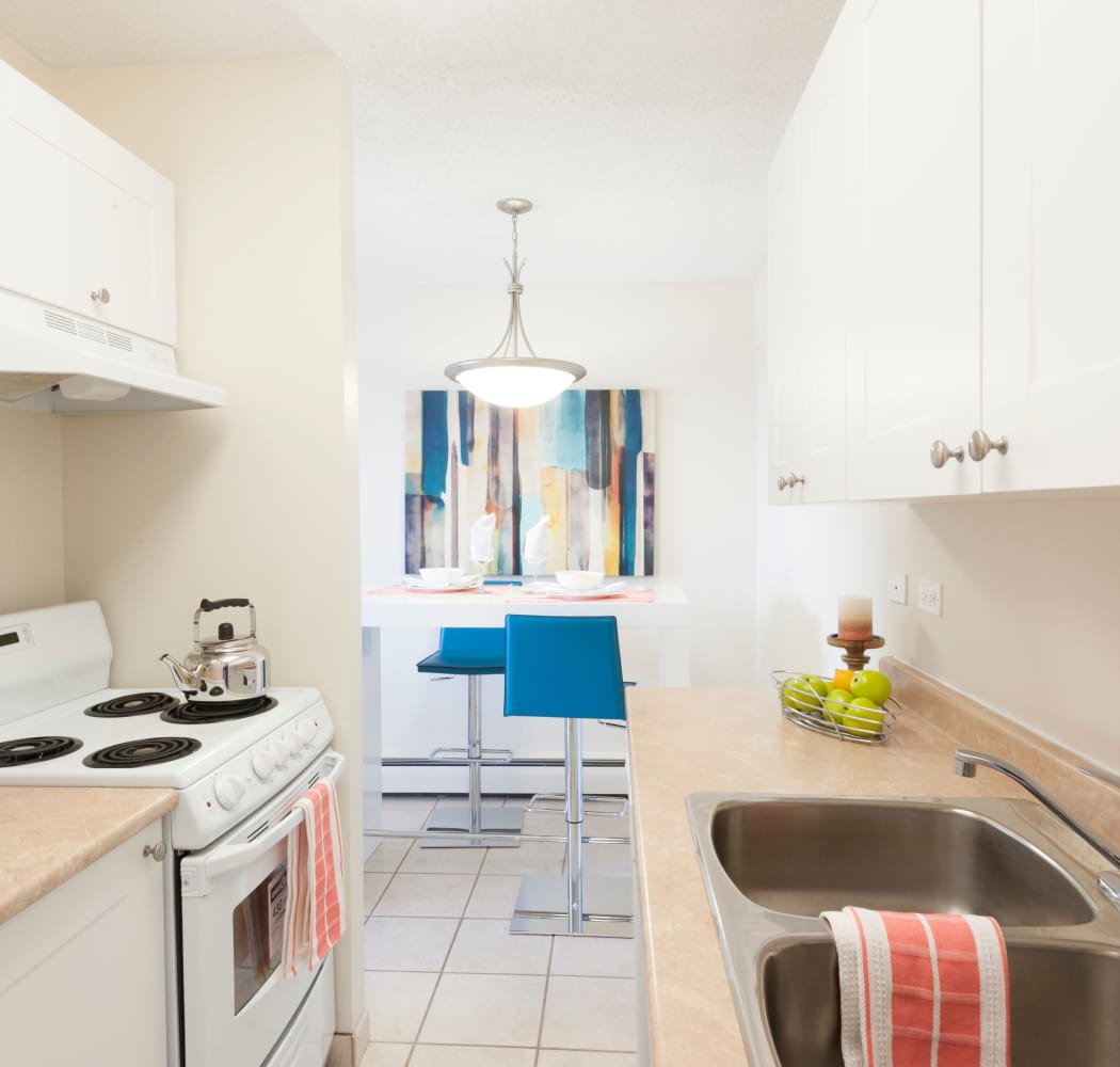 Well-equipped kitchen at Calgary Place Apartments