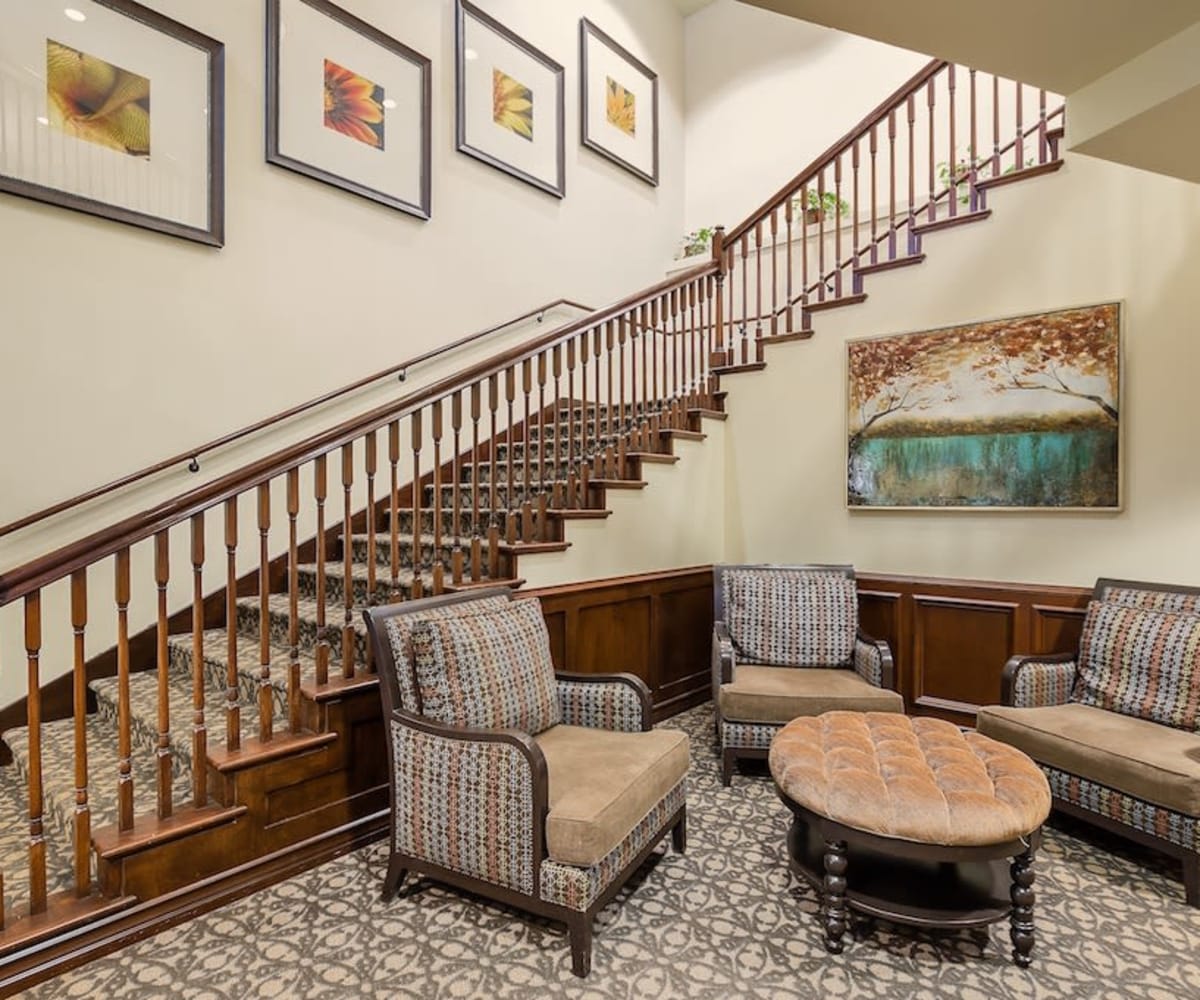 Lounge area and staircase at Pacifica Senior Living Country Crest in Oroville, California