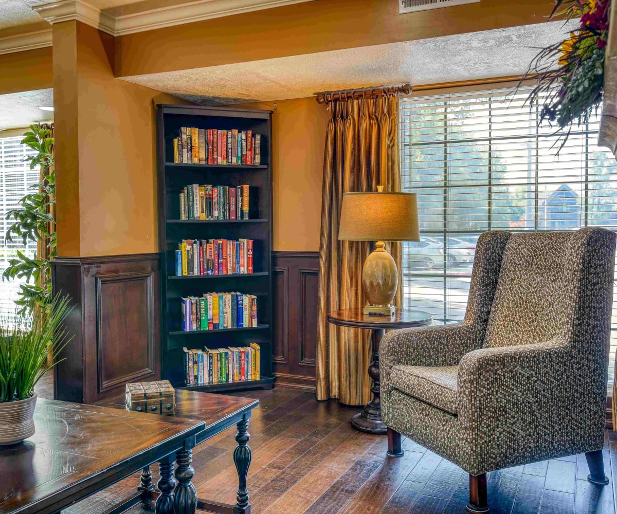 Lounging area with bookshelves at Pacifica Senior Living Millcreek in Salt Lake City, Utah