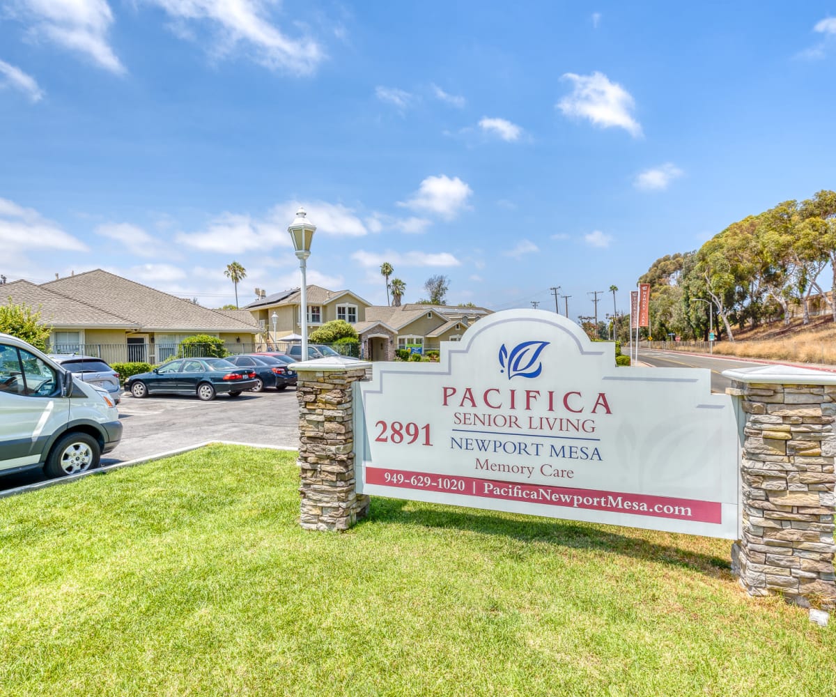 Front entrance with signage at Pacifica Senior Living Newport Mesa in Costa Mesa, California