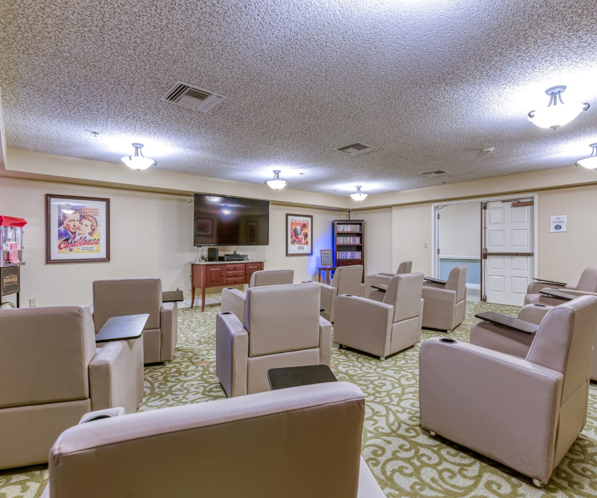Entertainment room with seating and television at Pacifica Senior Living Fresno in Fresno, California