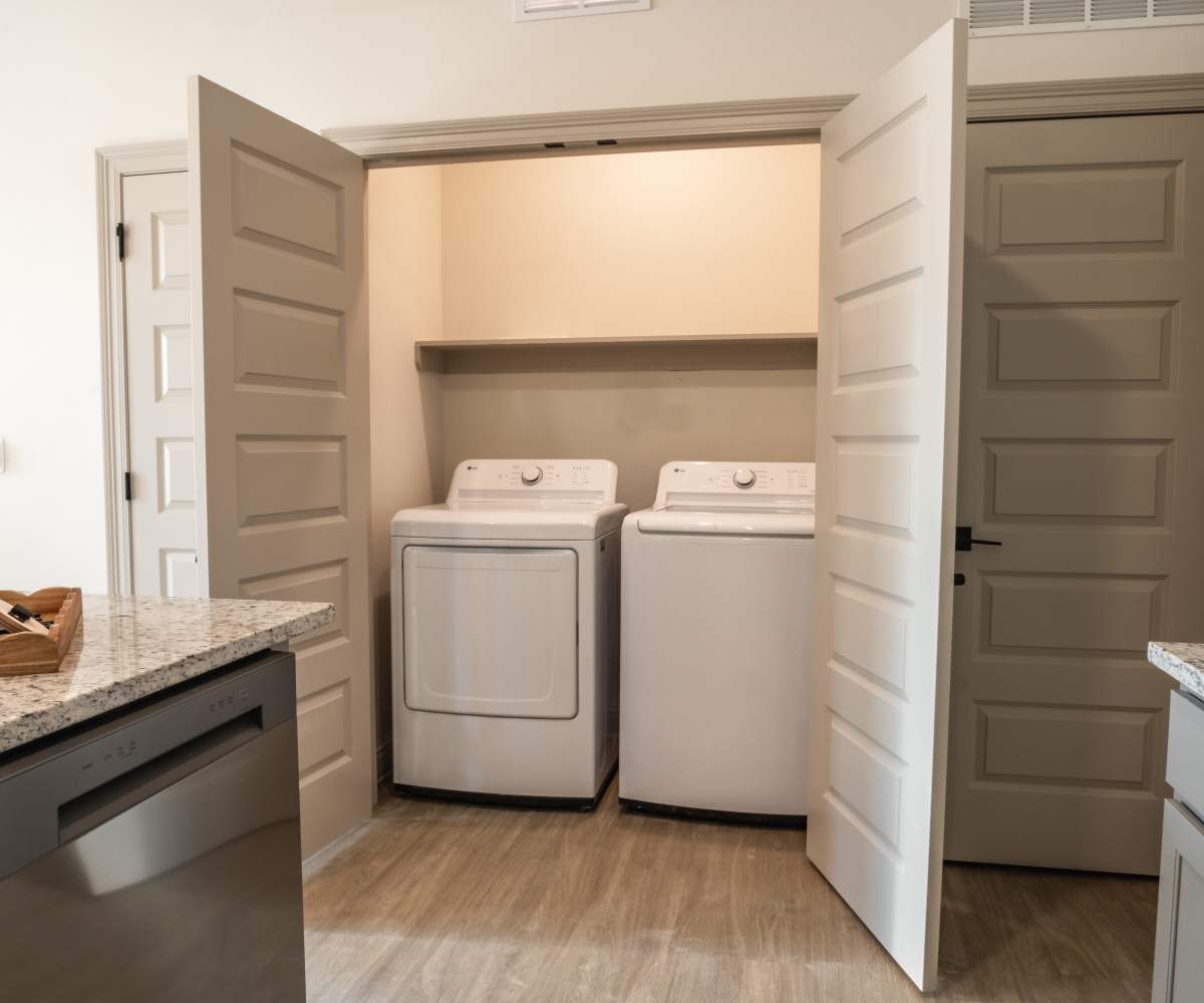 Laundry Area with opened Door at The Waters at Freeport in Freeport, Florida