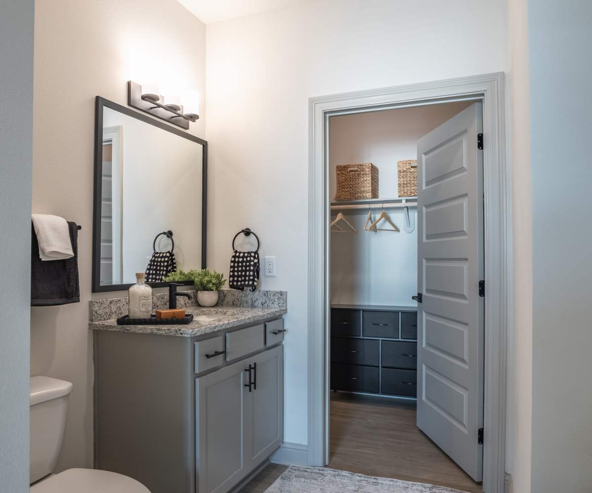 Bright Sink with Mirror with storage area at The Waters at Freeport in Freeport, Florida