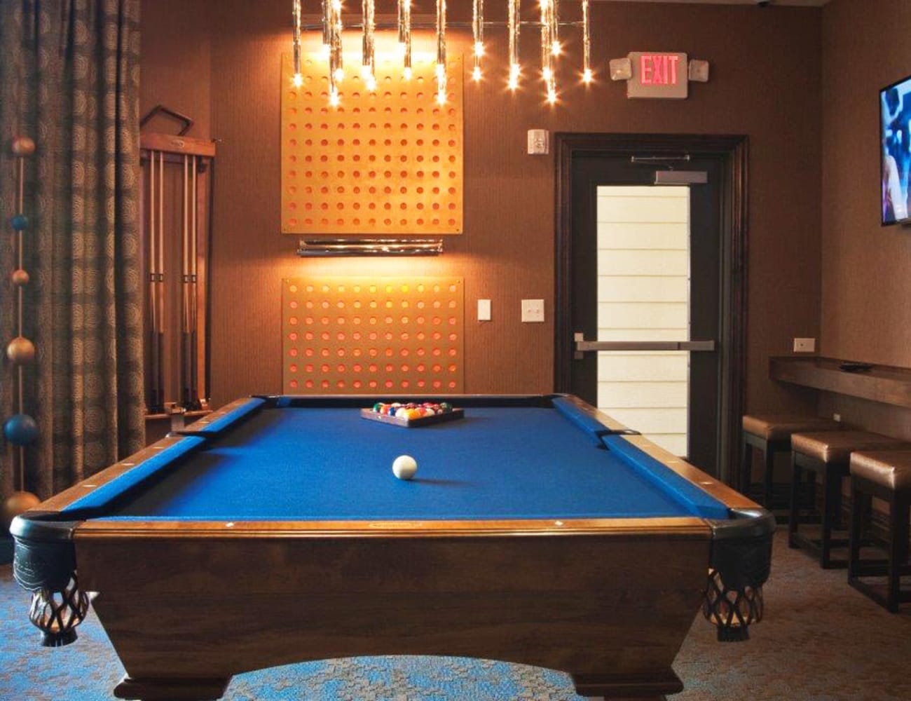 Resident clubhouse with billiards table and more at The Blvd in Irving, Texas