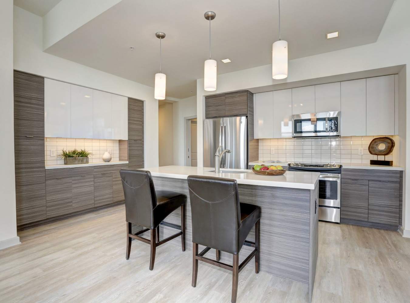 Dining area with kitchen at Solaire 7077 Woodmont in Bethesda, Maryland