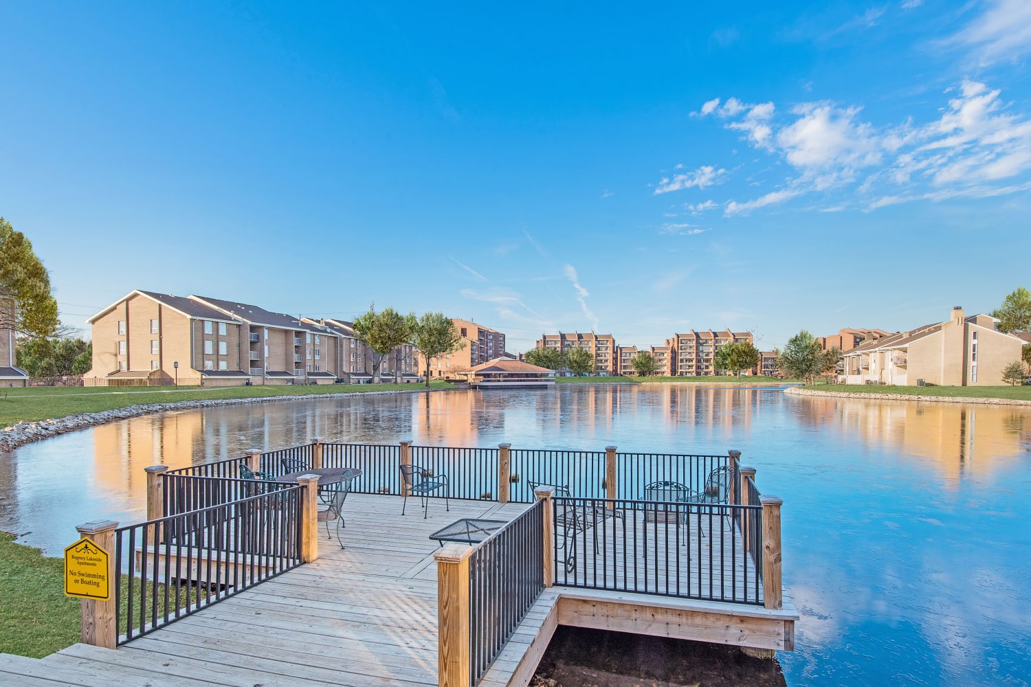 Pier and view of Regency Lakeside Apartment Homes across the lake in Omaha, Nebraska