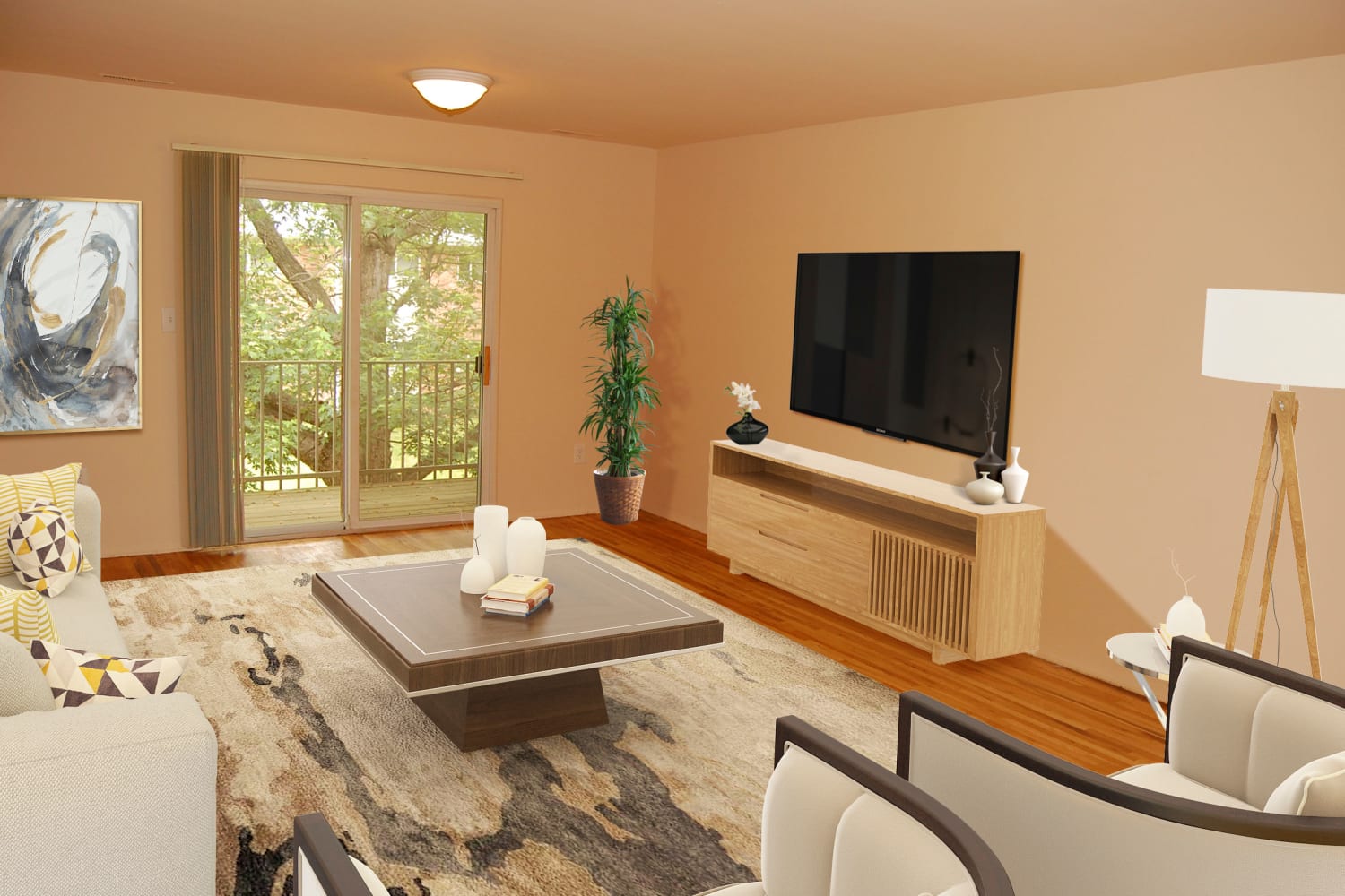 Model living room with beautiful hardwood floors at Tanglewood Terrace Apartment Homes in Piscataway, New Jersey