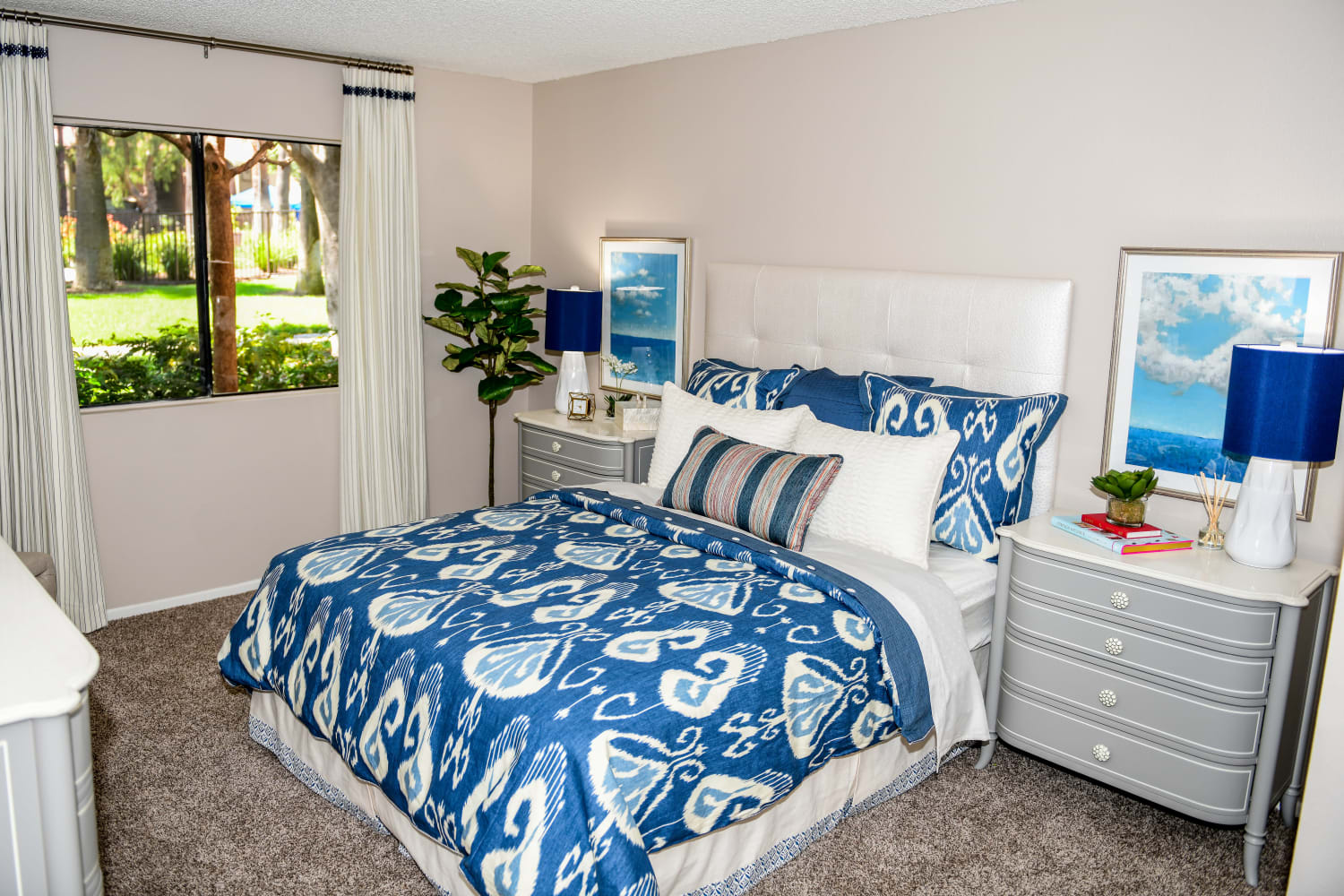 Sunlit bedroom at Parcwood Apartments in Corona, California