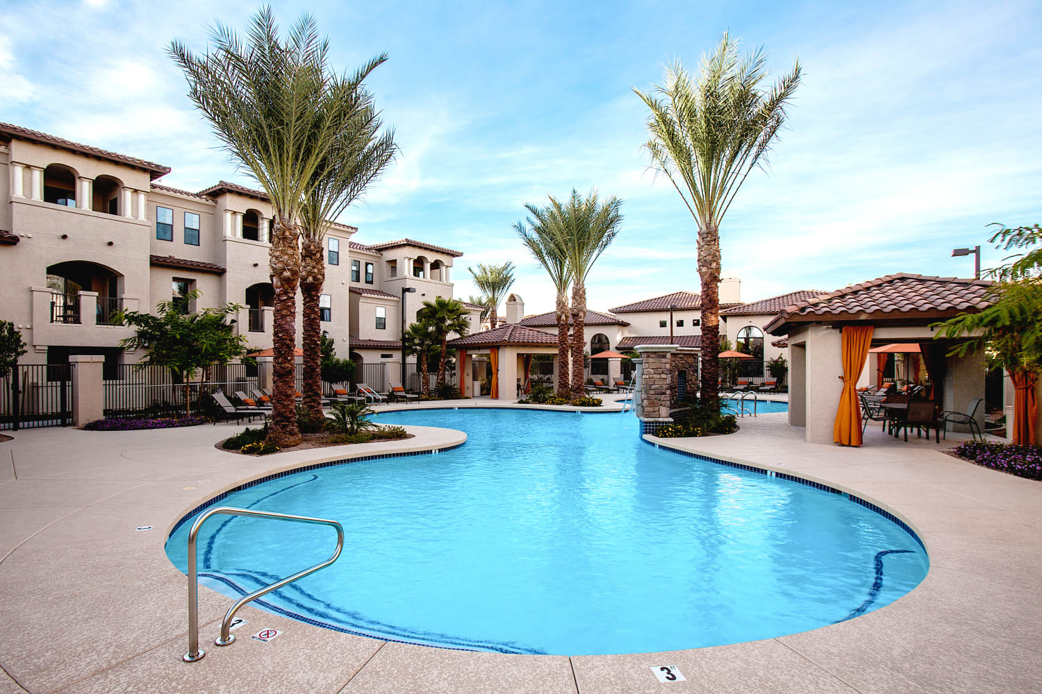 Large swimming pool with extensive poolside seating at San Marquis in Tempe, Arizona