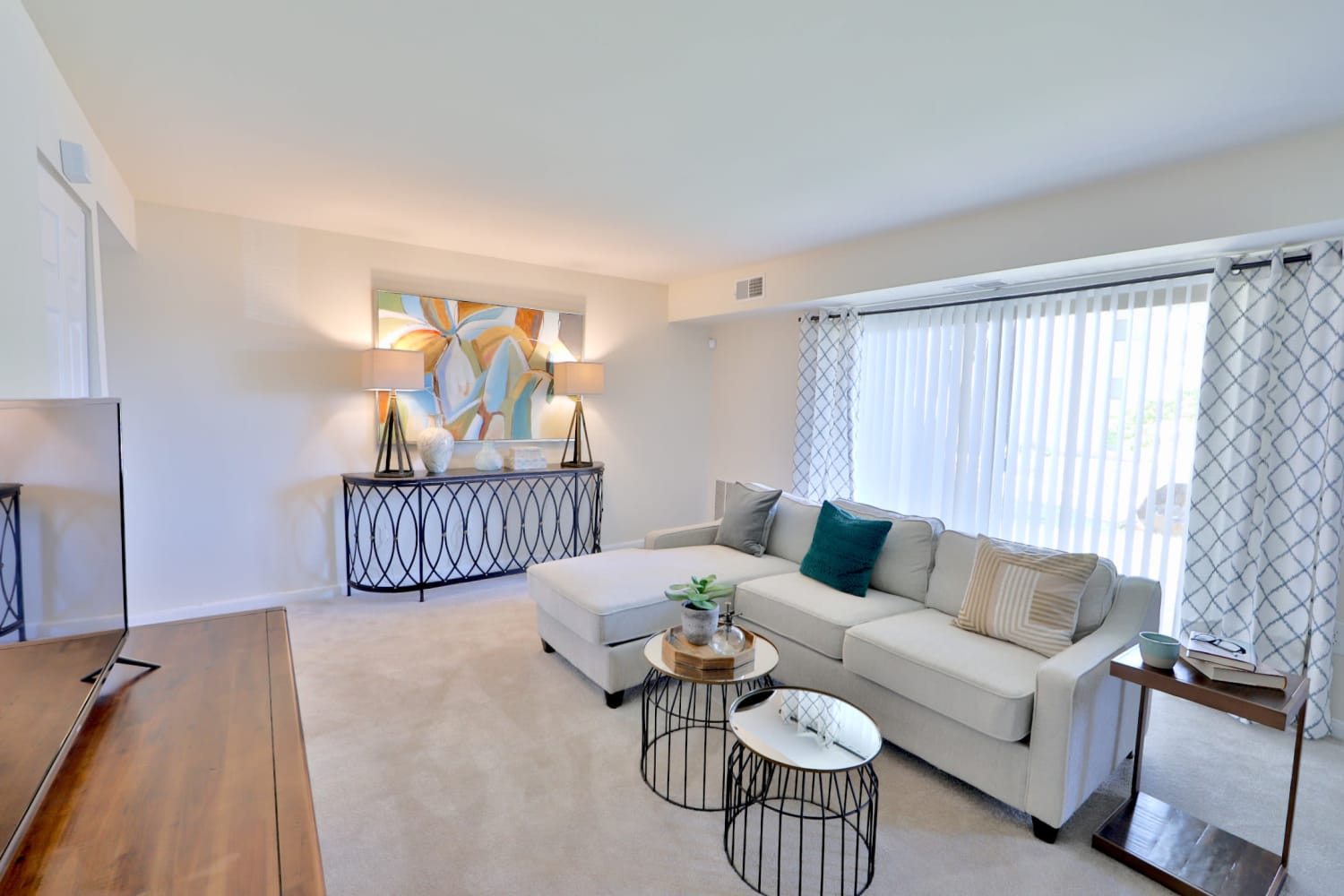 Spacious living room of a model home at Gwynn Oaks Landing Apartments & Townhomes in Baltimore, Maryland