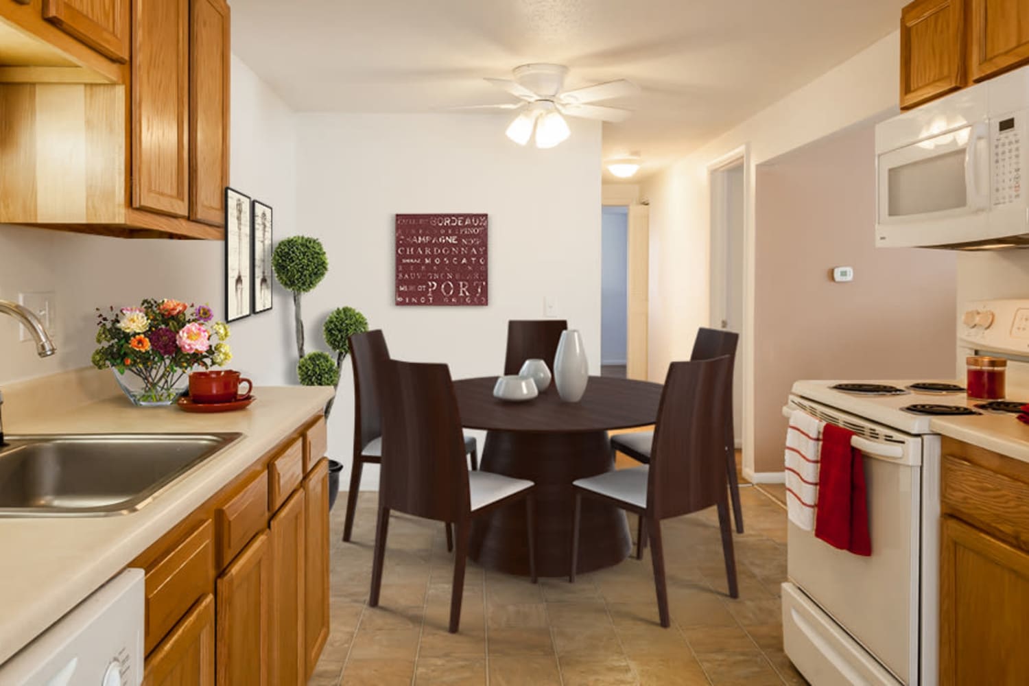 Kitchen and dining table at King's Court Manor Apartments in Rochester, New York