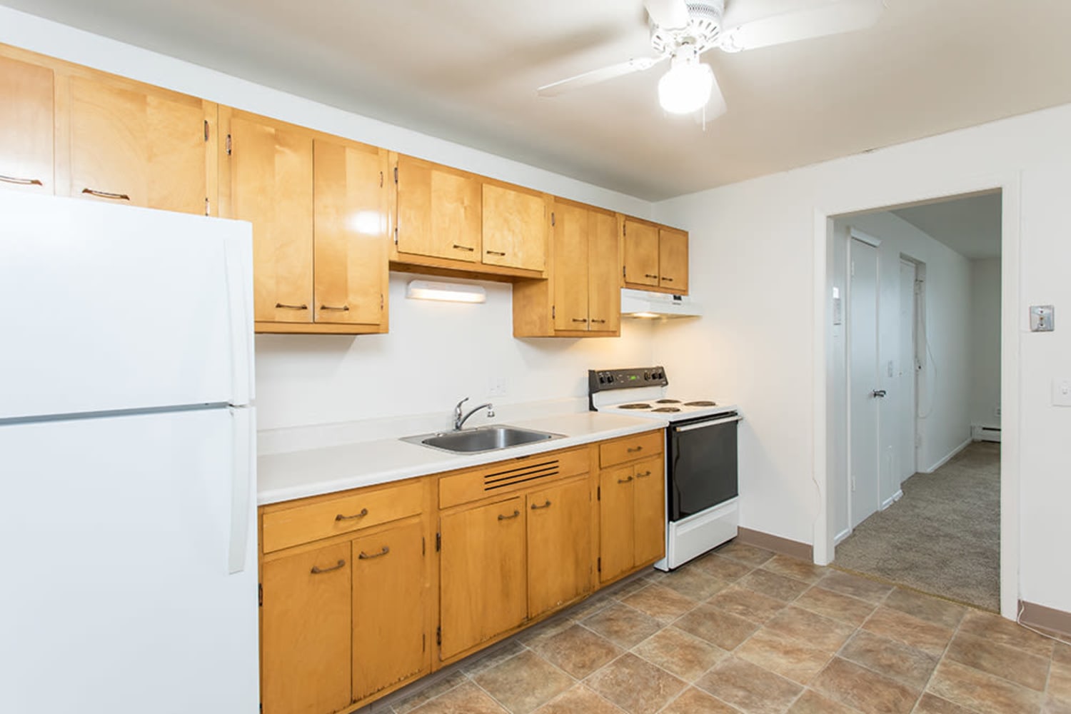 Fully equipped kitchen at Pittsford Garden Apartments in Pittsford, New York