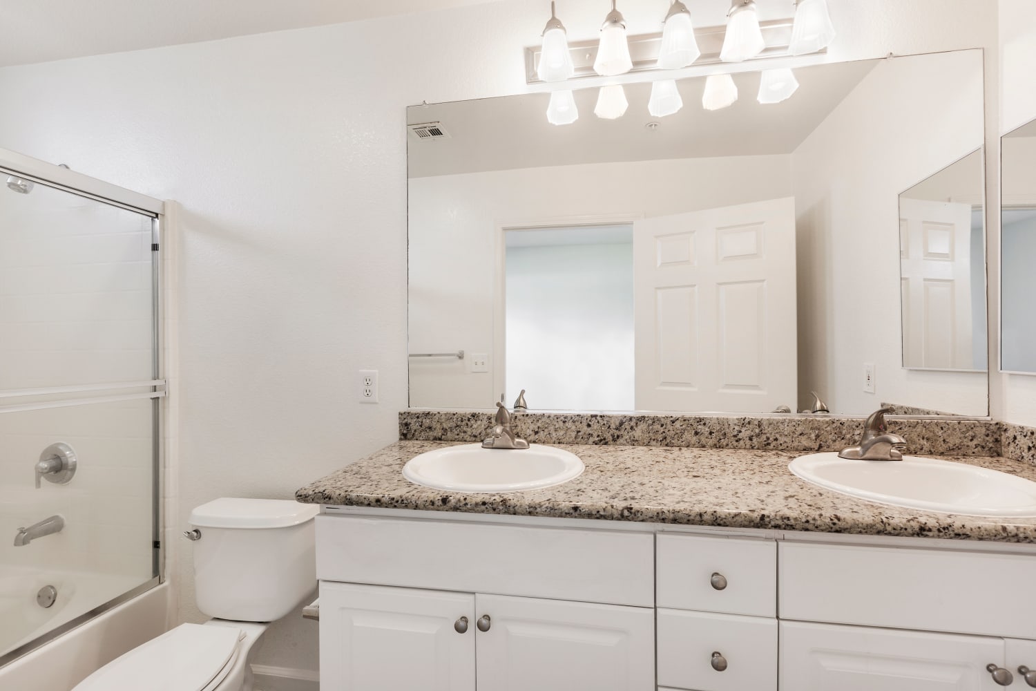 Enjoy the convenience of double sinks in bathrooms at Park Hacienda Apartments in Pleasanton, California