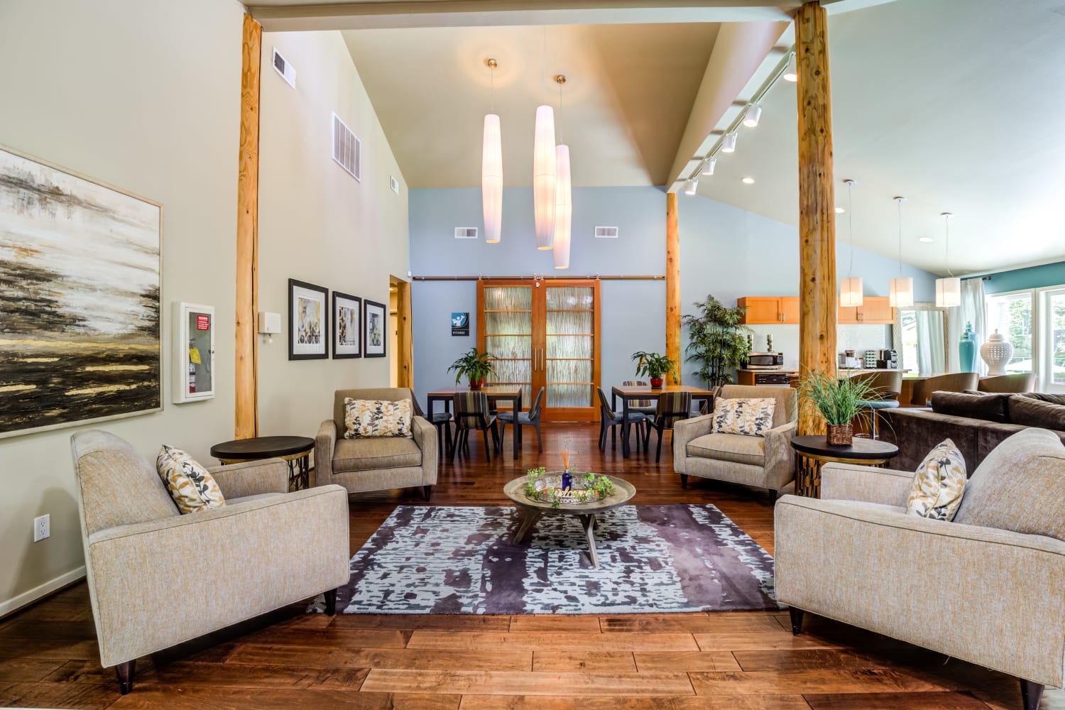 Clubhouse interior with community seating area and variety of decor at Vue Kirkland Apartments in Kirkland, Washington