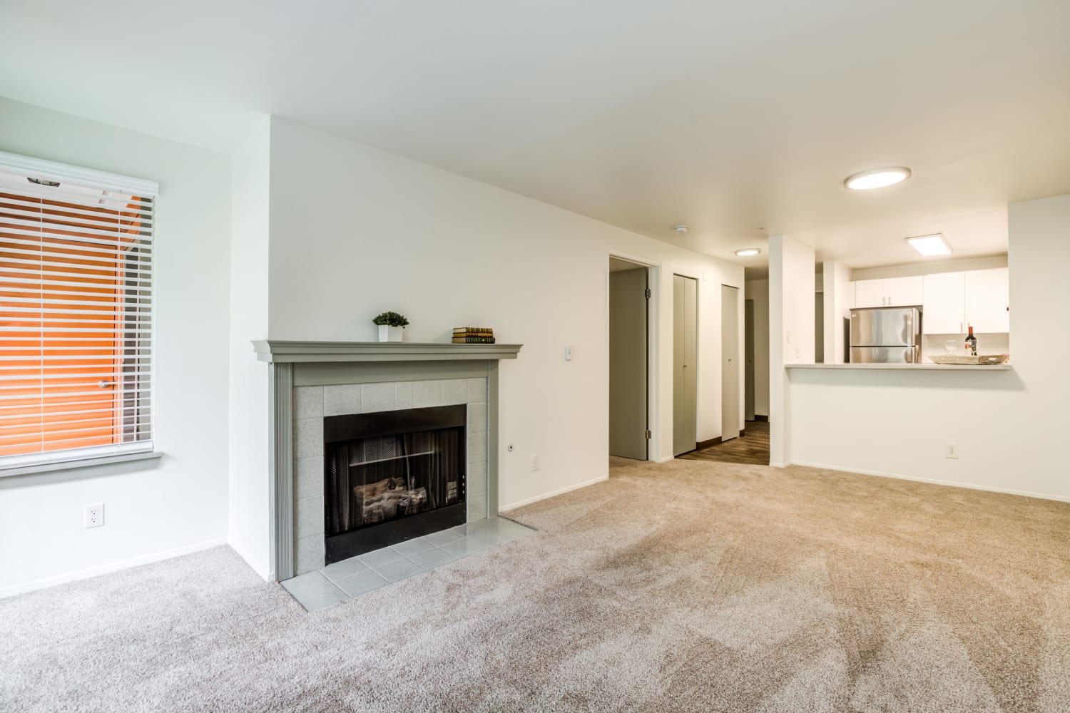 Living room featuring a fireplace at Metropolitan Park Apartments in Seattle, Washington