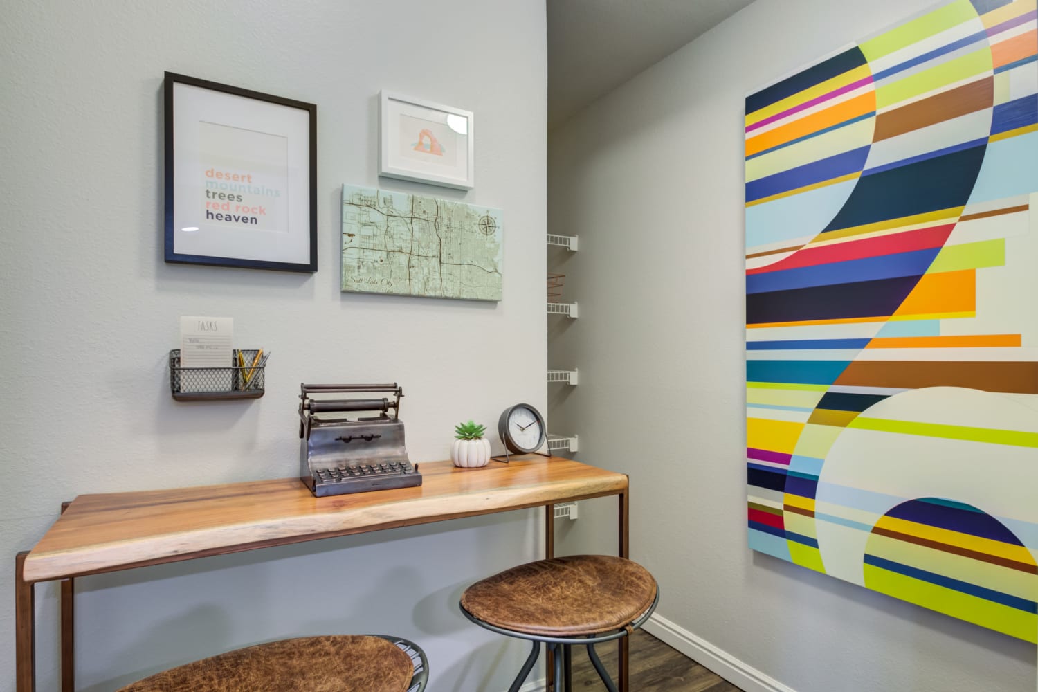 Abstract art on the walls and sitting area in an apartment at Irving Schoolhouse Apartments in Salt Lake City, Utah