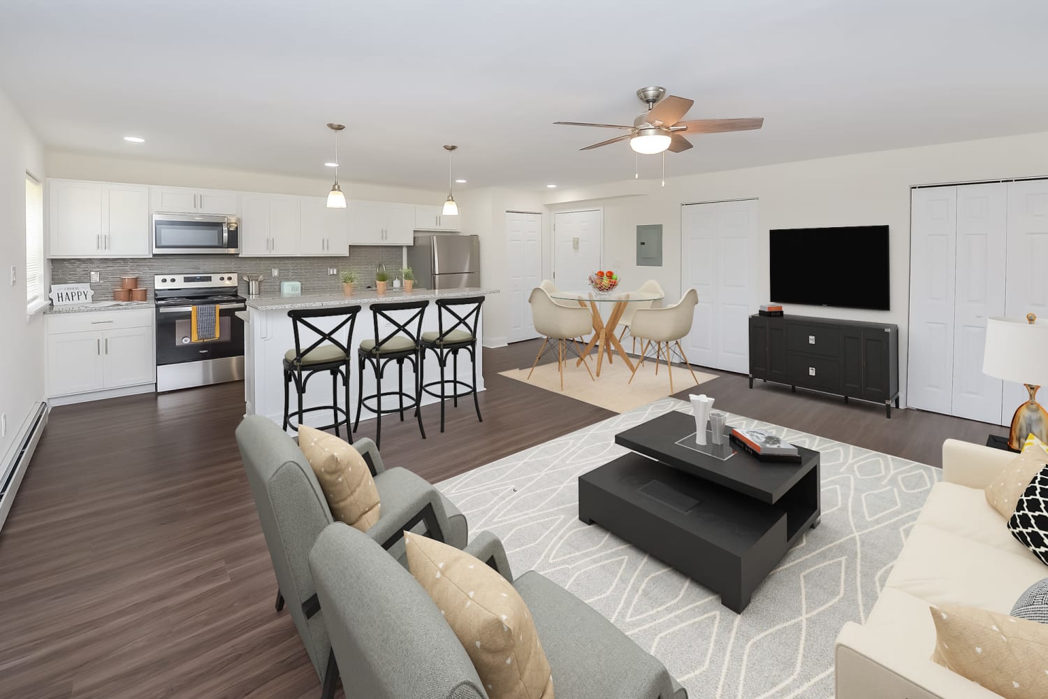 Beautiful open layout model home with vinyl plank flooring at Kingswood Apartments & Townhomes in King of Prussia, Pennsylvania