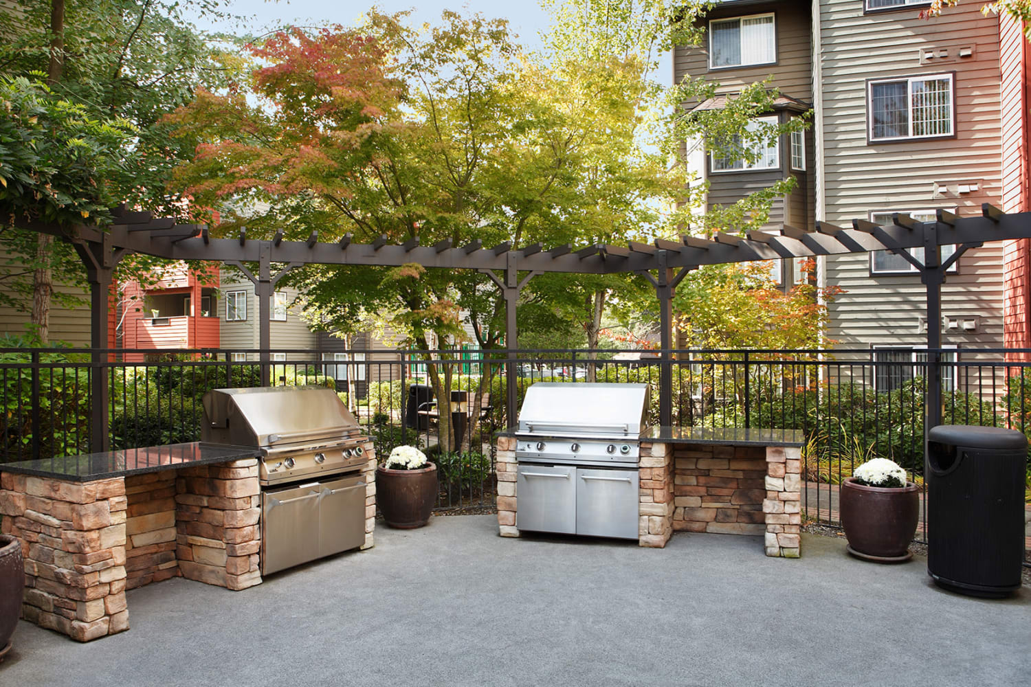 Spacious community BBQ area for residents at Redmond Place Apartments in Redmond, Washington