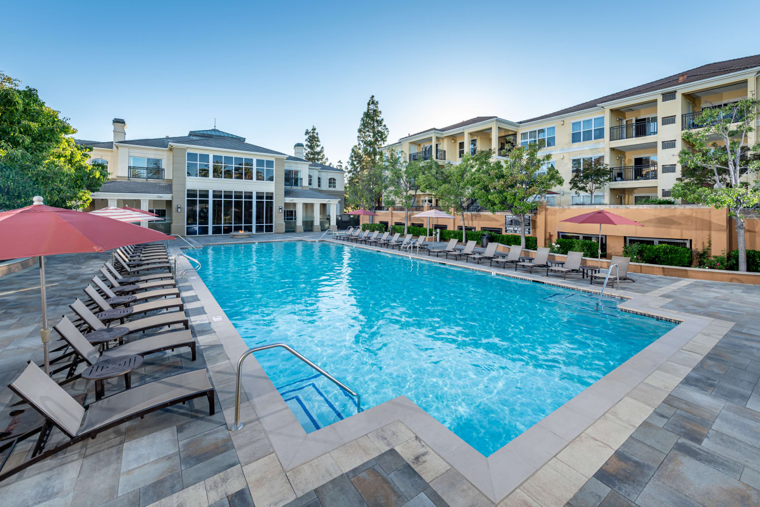 Exterior view of swimming pool at The Carlyle Apartments