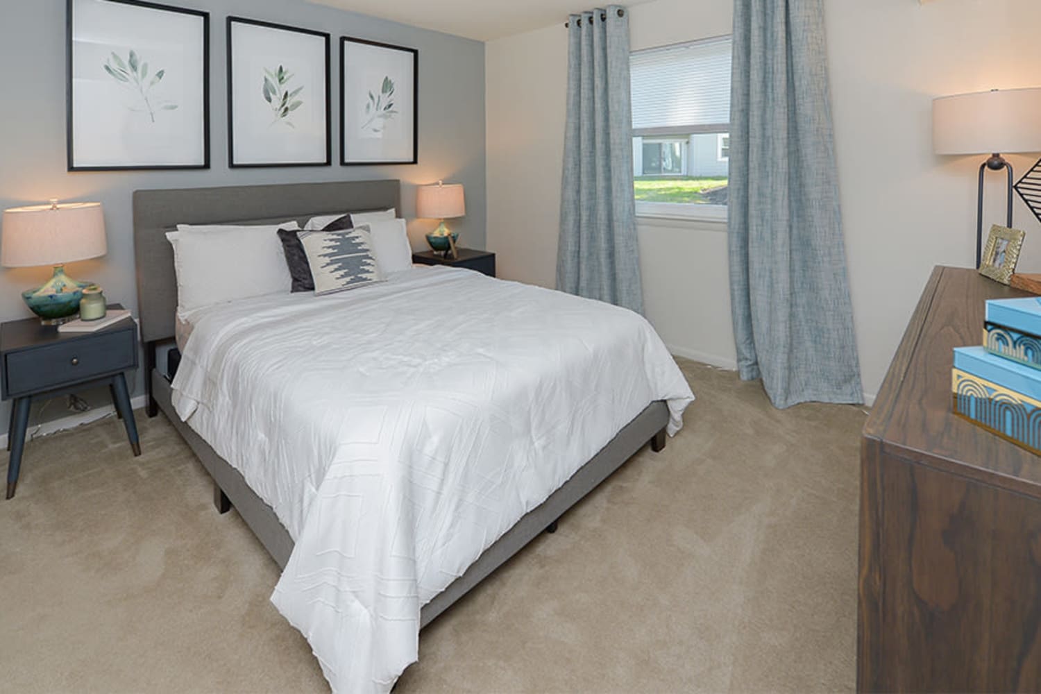 Model bedroom with plush carpeting at The Landings Apartment Homes in Absecon, New Jersey