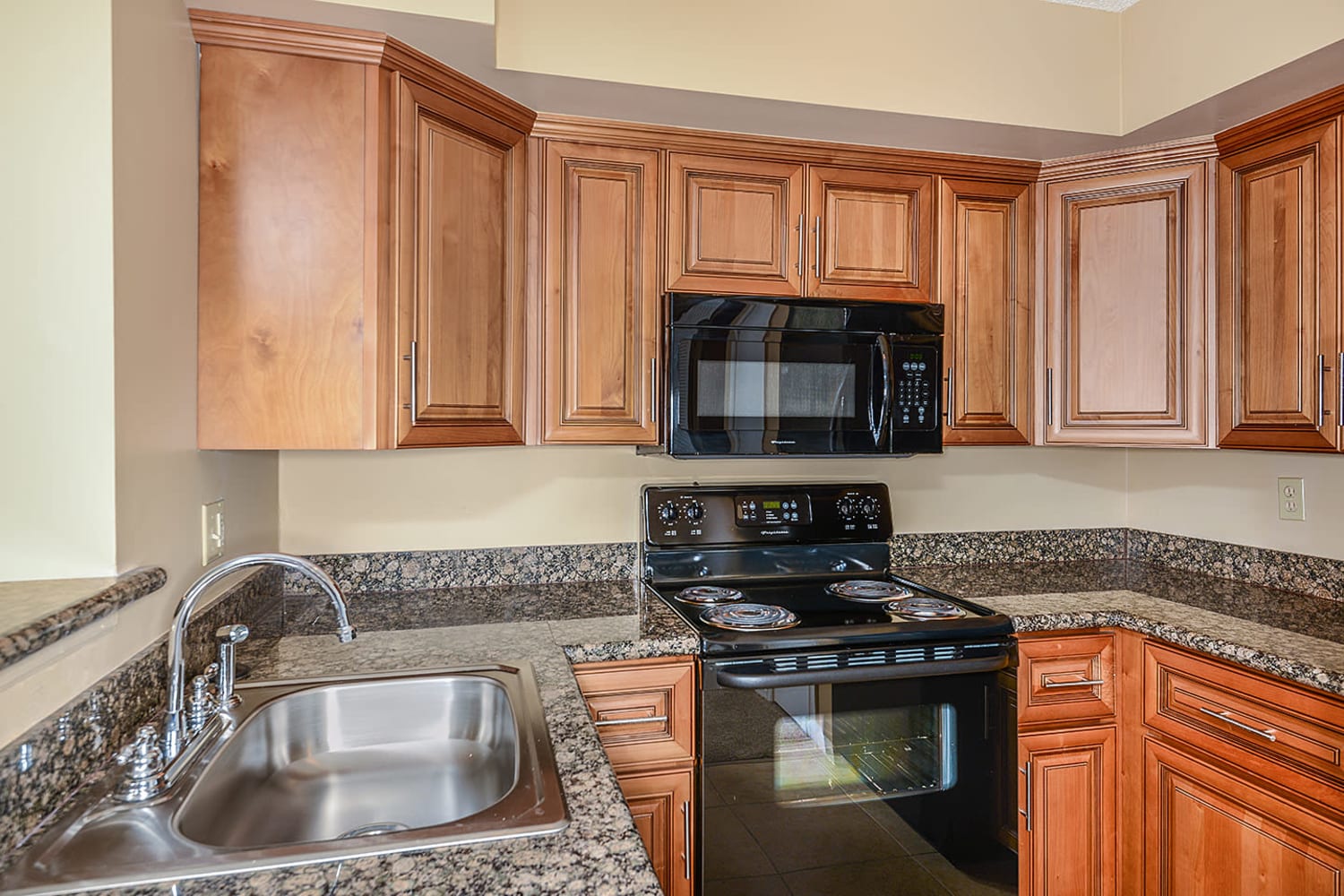 All electric kitchen at Royal St. George at the Villages Apartment Homes in West Palm Beach, Florida